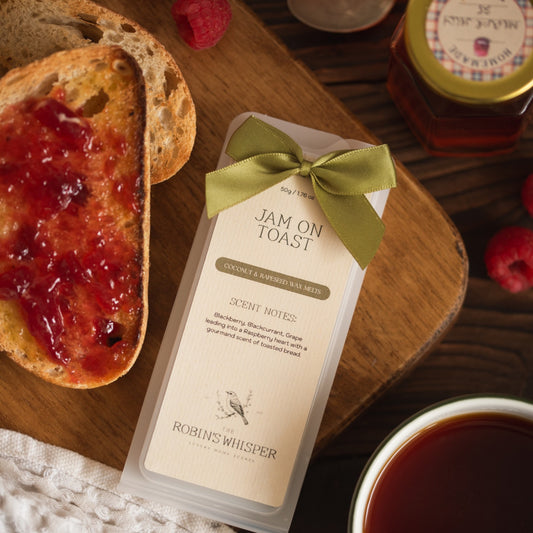 Jam on toast wax melts shown on a board with slices of bread with jam on.
