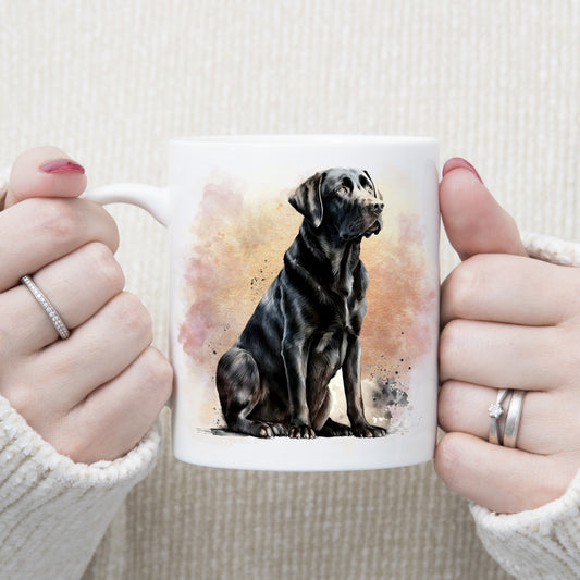 Image of a Black Labrador dog sitting with a pink and gold smoky background. The mug is being held by a  woman wearing rings.