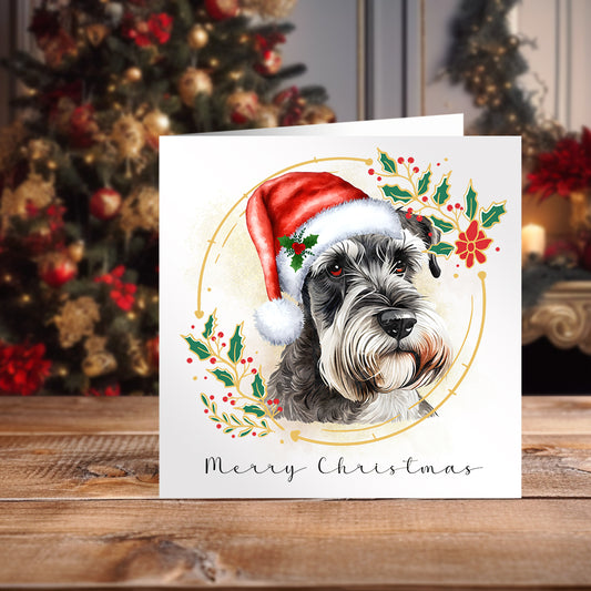 White Christmas themed card with a Miniature Schnauzer wearing a Santa hat. A decorated Christmas tree fills the background.