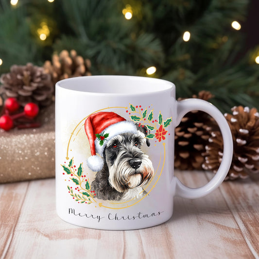 White ceramic mug featuring a Miniature Schnauzer in a Christmas theme with pine cones and gifts adorn the background.