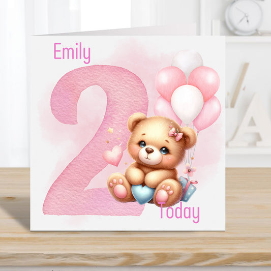 Birthday card for a little girl aged 2. Personalised with a name. Teddy holding a heart and balloons in the background.