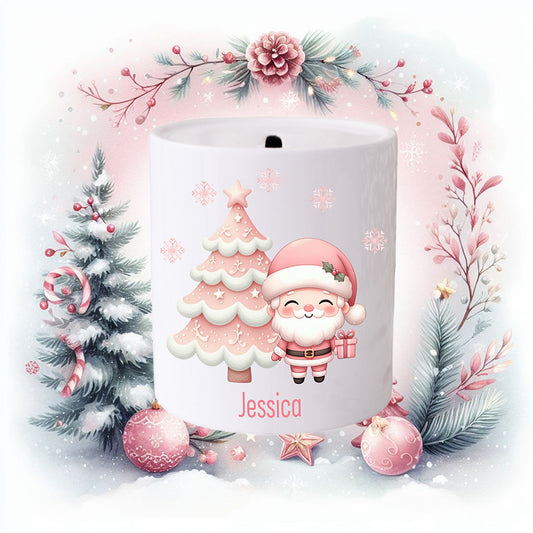 Personalised Christmas money jar for a girl.  Santa dressed in pink with a pink Christmas tree.  Christmas scene around the jar.