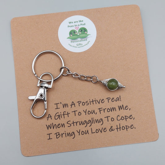 positive pea keyring