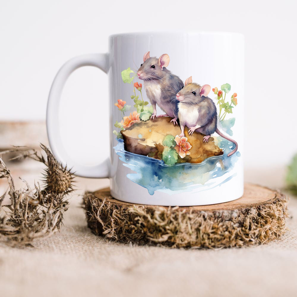 Two rats sat on a rock in water shown on a white ceramic mug.  The mug is placed on a rustic wooden disc.