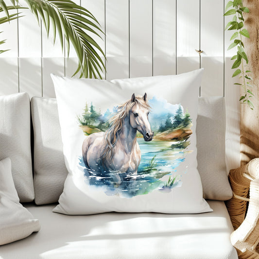 A white horse stands chest high in a river with trees in the background on the front of a white cushion which is placed on a cream sofa. White panels and green fern create the background.