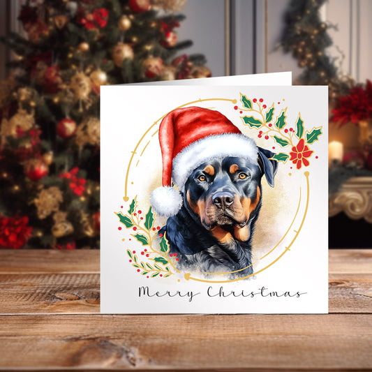 Rottweiler wearing a Santa hat on a Christmas themed Card positioned in front of a decorated Christmas Tree.