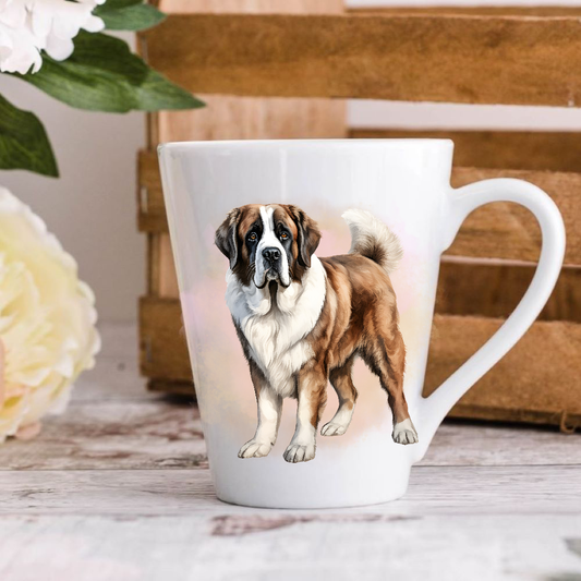 A white ceramic latte mug stands on a wooden surface with a crate in the background. The mug features a Saint Bernard dog. A large yellow flower peeps in from the left-hand side.