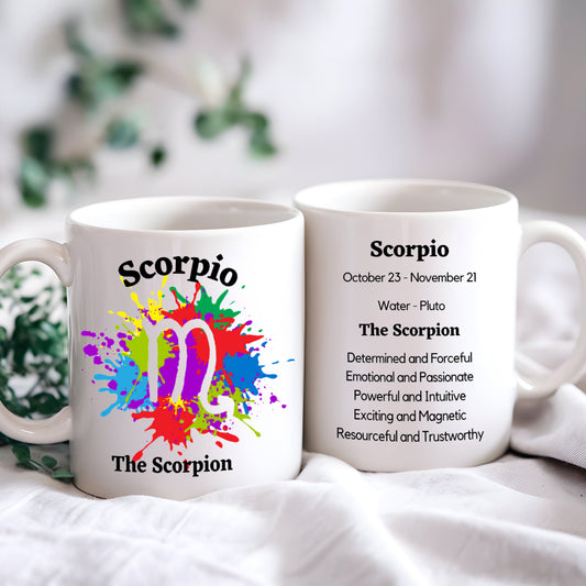 A white ceramic mug with a colourful abstract design and the text 'Scorpio' along with the Scorpio symbol. The mug is displayed with a definition and characteristics of the Scorpio zodiac sign.