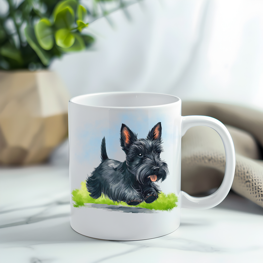 This coffee mug features a black Scottish Terrier on a white ceramic mug which has been placed on a grey marble surface. A green plant sits in the left corner.