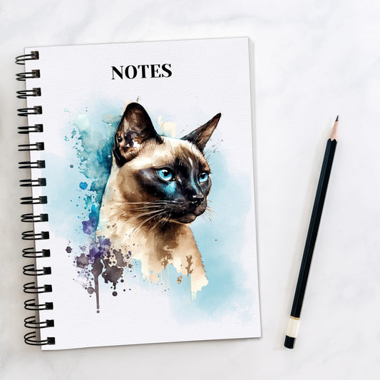 white notebook with a siamese cat head and blue smokey background and splash detailing