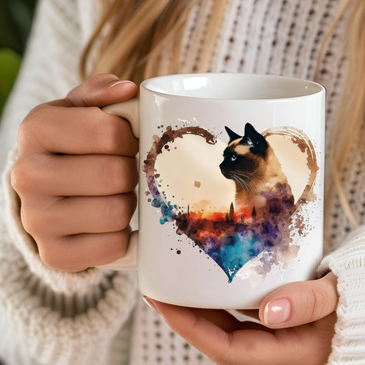 hand held white ceramic mug with siamese cat on a heart and splash detailing