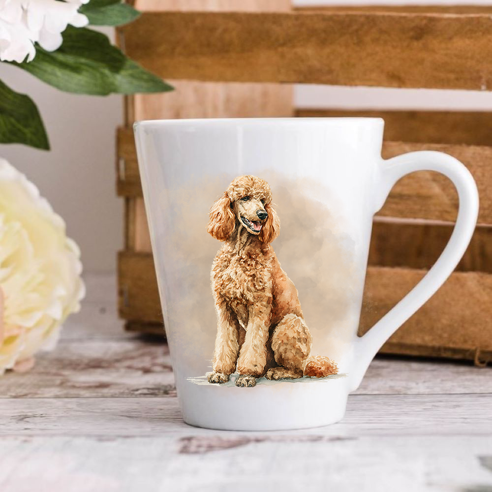 A white ceramic latte mug stands on a wooden surface with a wood crate in the background. The mug features an Apricot Standard Poodle.  A large yellow flower peeps in from the left-hand side.