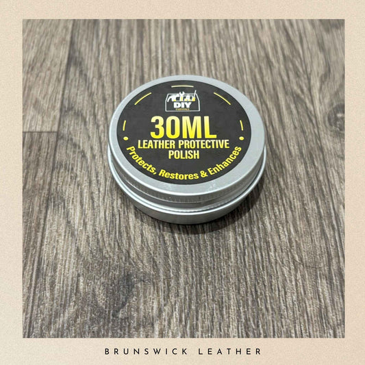 30ML leather protective polish container on a wooden surface with 'Brunswick Leather' branding.