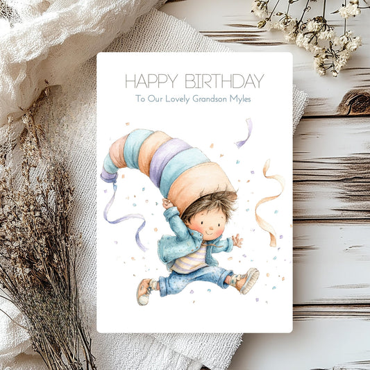 Birthday card with a child holding a large balloon, surrounded by decorative elements on a wooden surface.