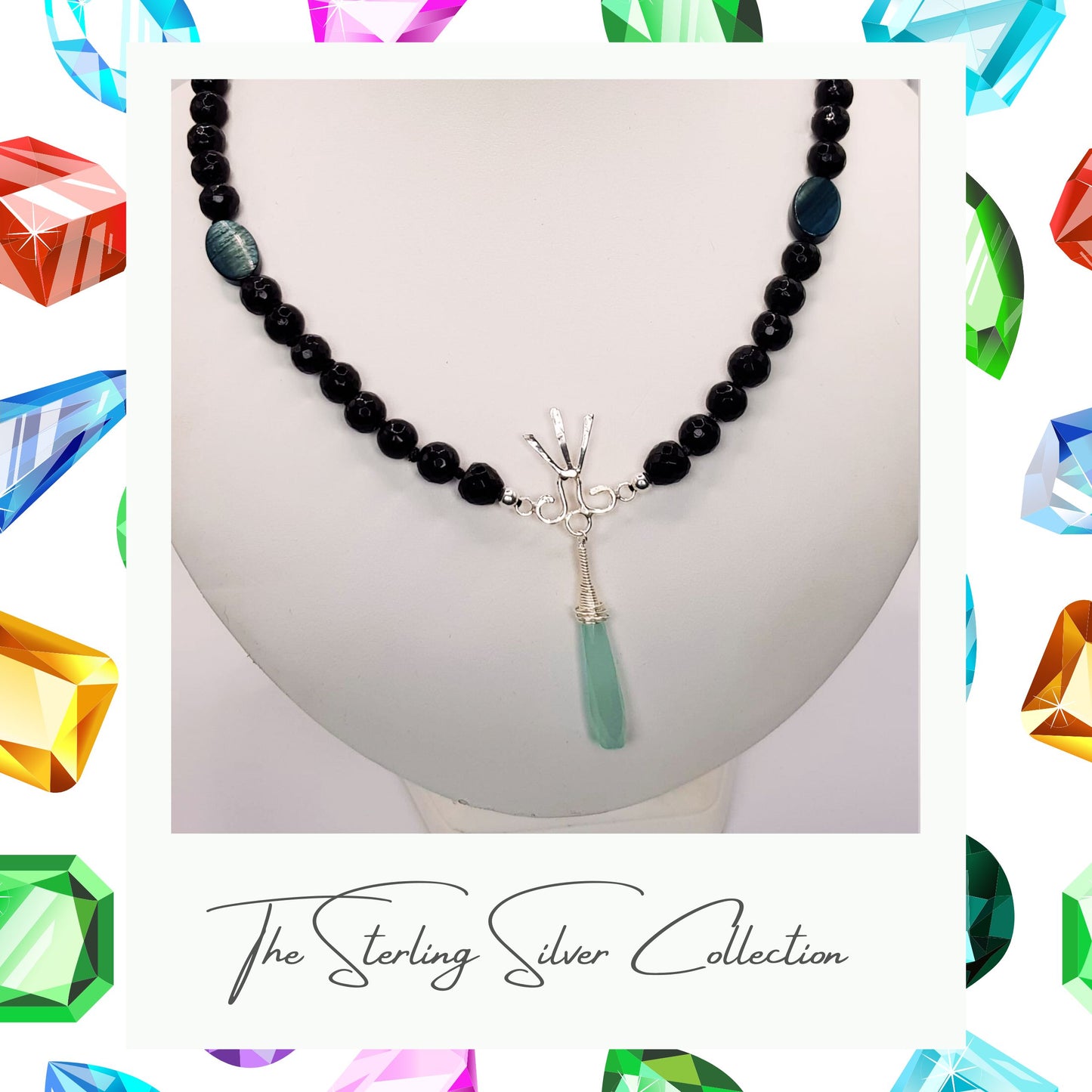 A blue gemstone necklace with black agate on a necklace stand.
