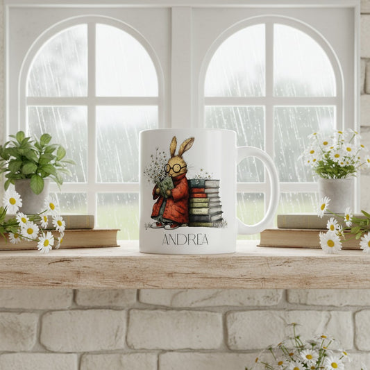 White mug with a hare design on a wooden surface with a window and plants in the background