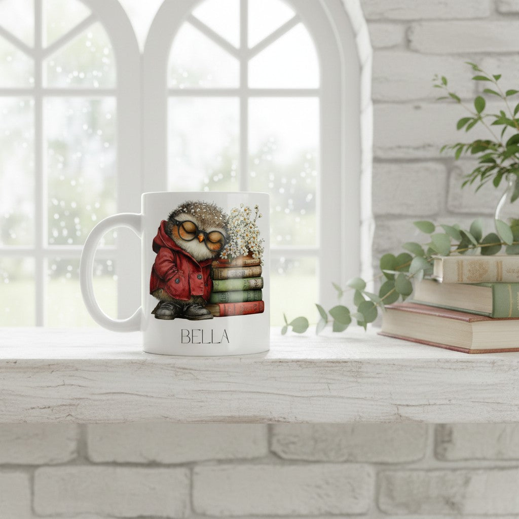 Mug with an owl design and 'Bella' branding on a windowsill with books and plants.