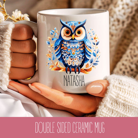 A double-sided ceramic mug with a printed owl design and the name 'Natasha' on it.