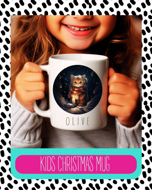 A child holding a white ceramic mug with a Christmas themed design featuring an illustration of a cat, smiling and with text 'Kids Christmas Mug'.