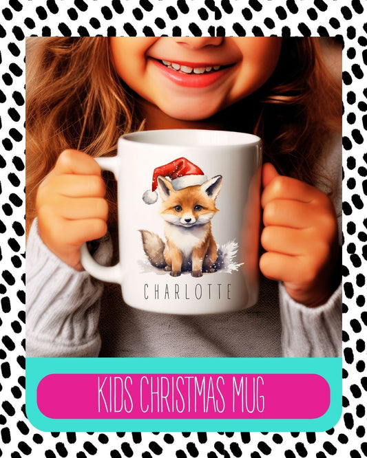 A personalised Christmas mug with a fox design, being held by a smiling person. The mug has the name 'Charlotte' printed on it, and the text 'Kids Christmas Mug' is visible on the image.
