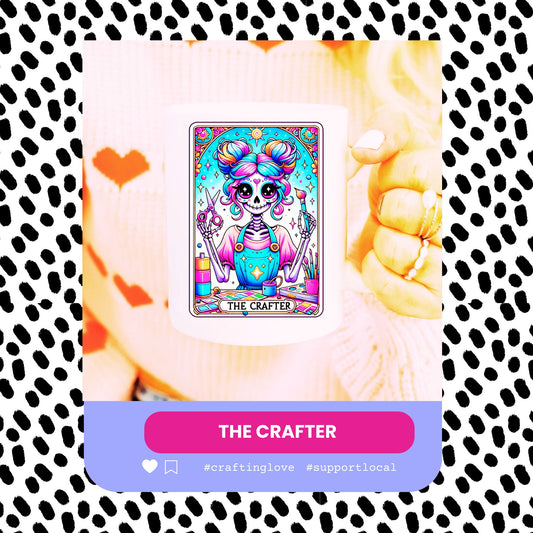 A colourful coffee mug with a character design and the text 'The Crafter' on a dotted background, held by a person.