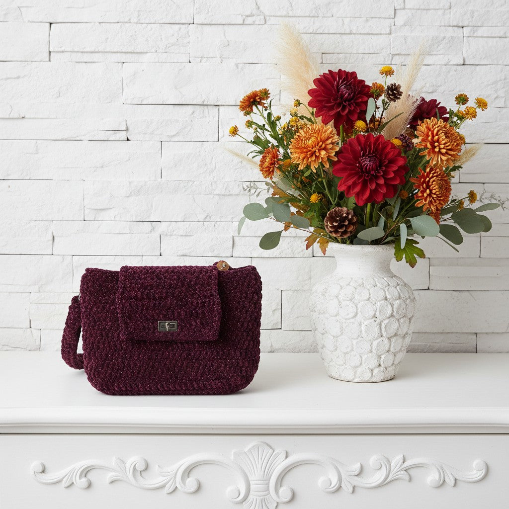 Pretty crochet handbag with a vase full of flowers