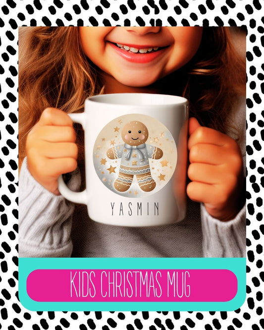 A child holding a personalised ceramic mug with a gingerbread design and their name 'Yasmin' printed on it.