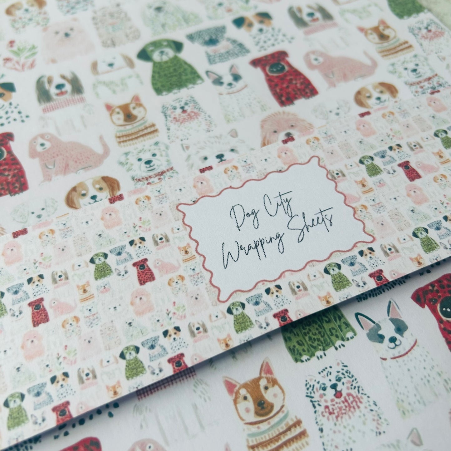 Dog-themed wrapping sheets with illustrations of dogs and text on a white background.