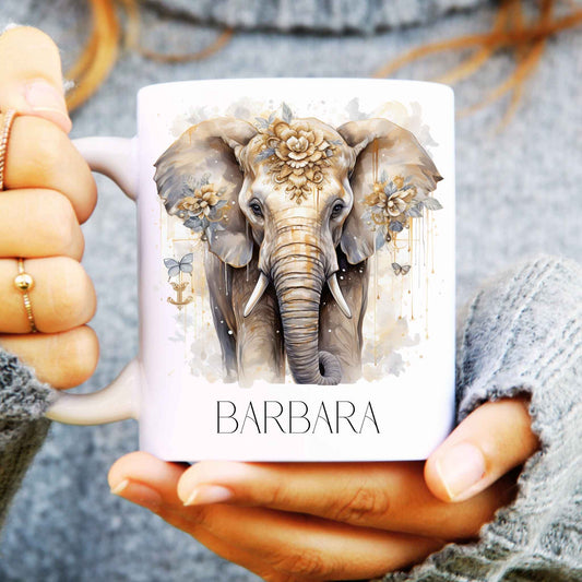 Mug held in hands with elephant design and personalised with a name