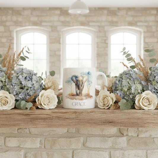 Decorative mug with elephant design on a mantelpiece with flowers and plants.