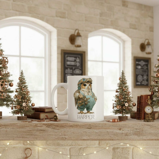 Mug with steampunk owl design and 'Harper' text on a decorative table with Christmas trees and books.