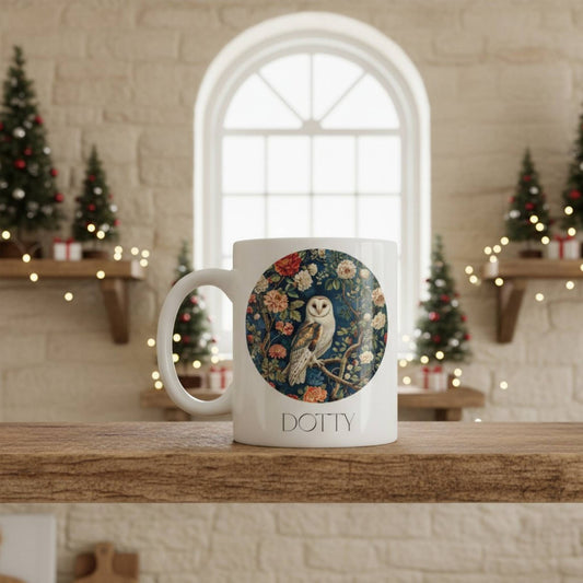 Mug with owl design and 'Dotty' branding on a wooden surface with festive background