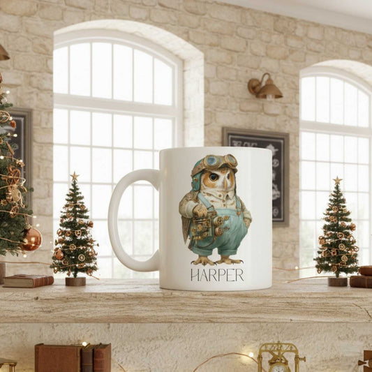 White mug with a steampunk owl design and 'Harper' text in a cosy room with Christmas trees.