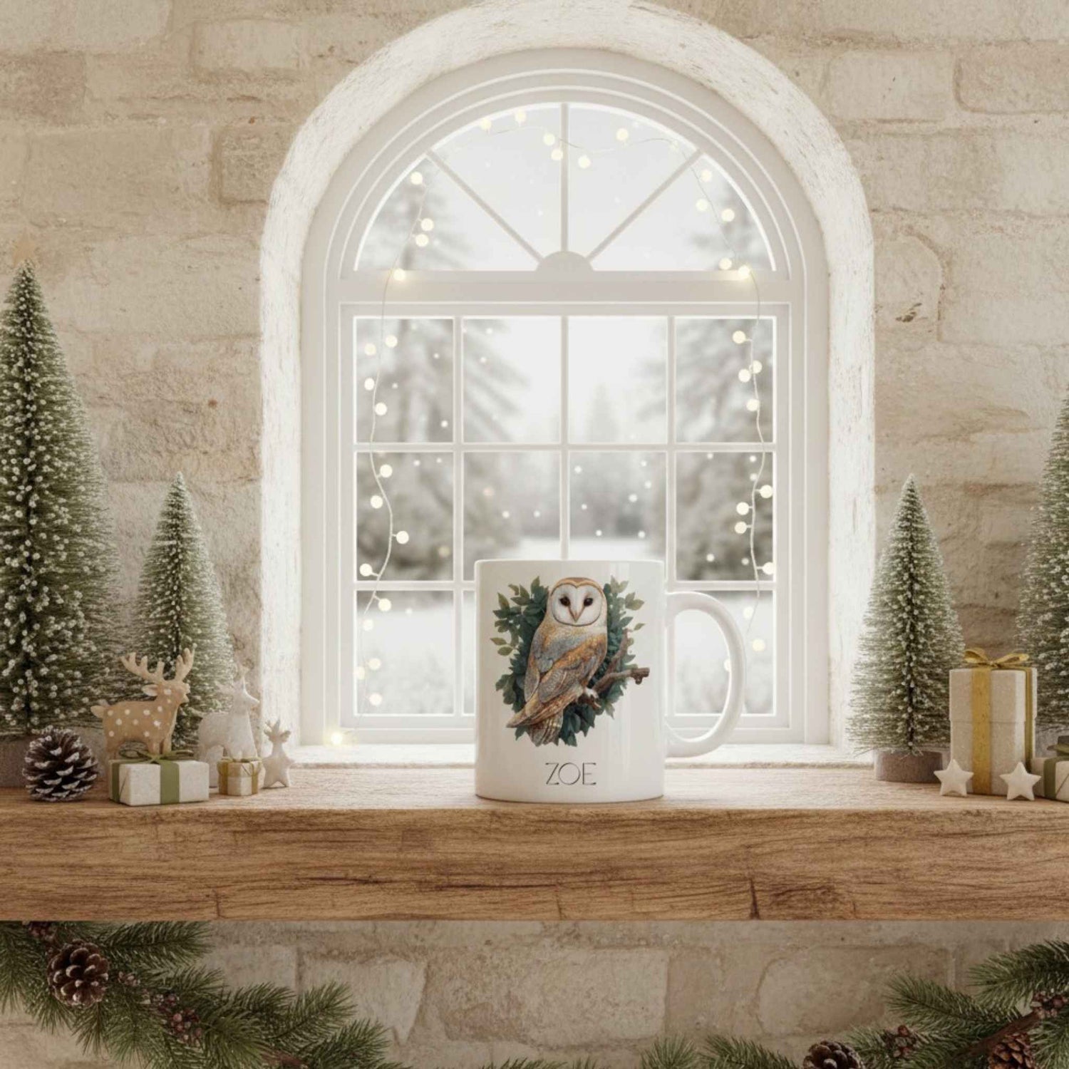 Mug with owl design on a Christmas-themed windowsill with decorative trees and lights.