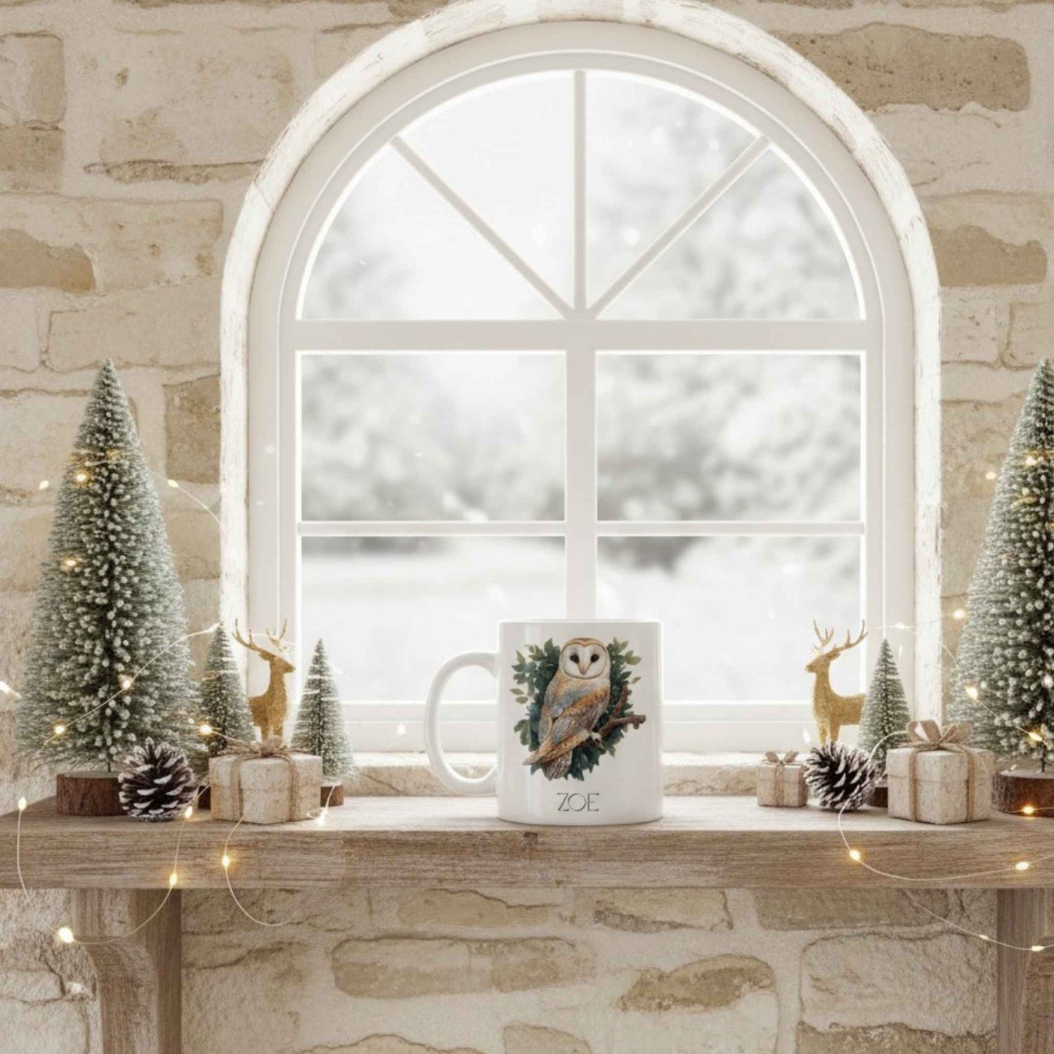 White mug with owl design on a wooden surface with Christmas decorations.