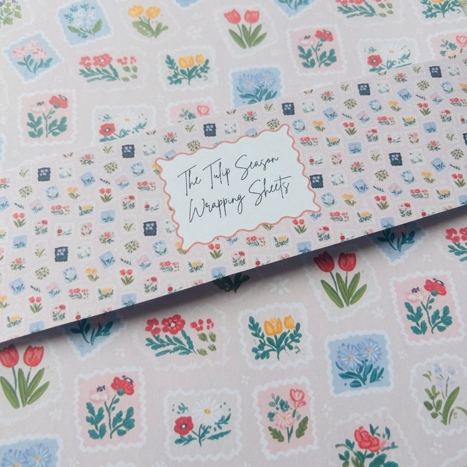 Floral patterned wrapping sheets with 'The Tulip Season' text.