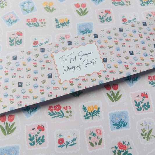 Floral patterned wrapping sheets with 'The Tulip Season' text.
