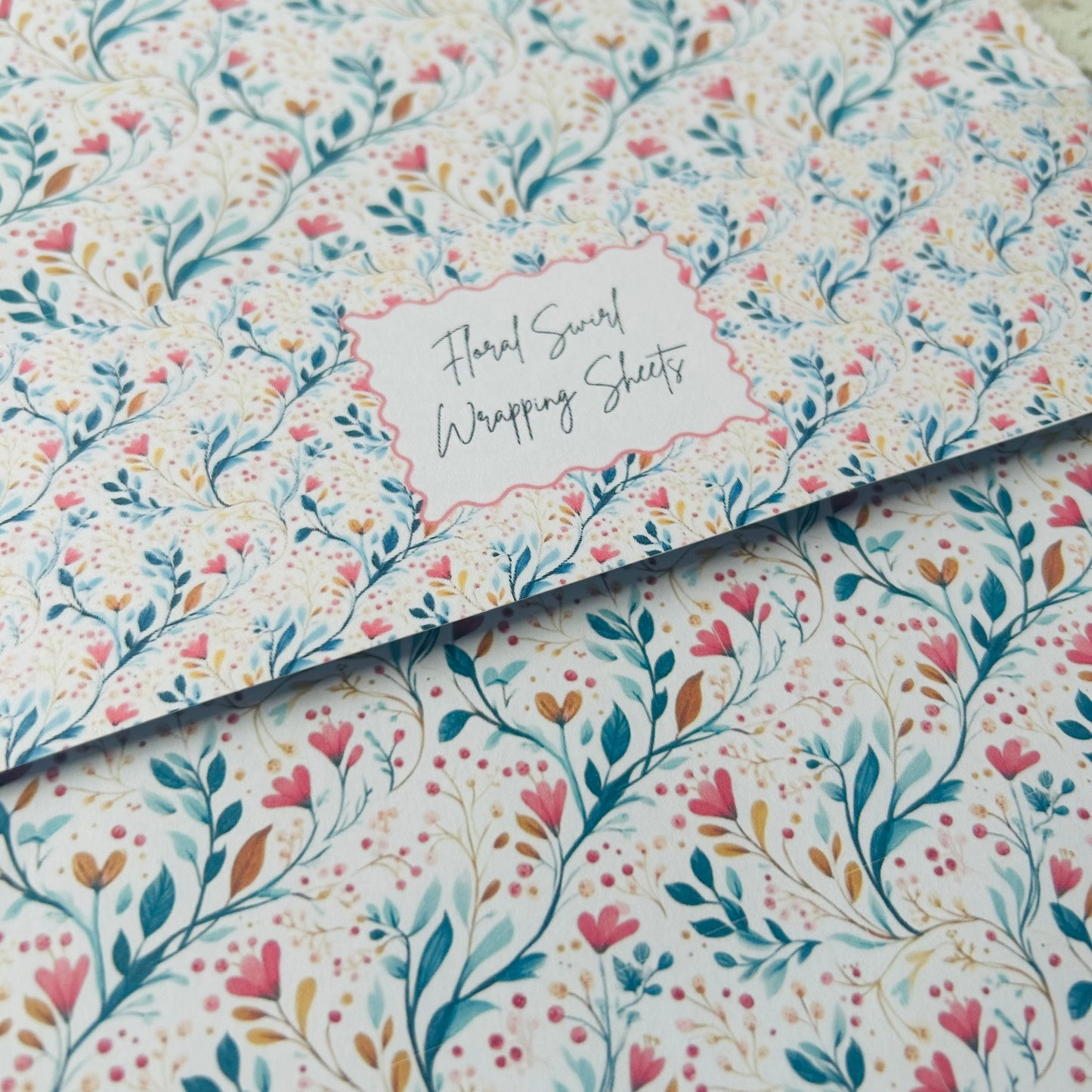 Floral patterned wrapping sheets with 'Floral Scroll Wrapping Sheets' text.