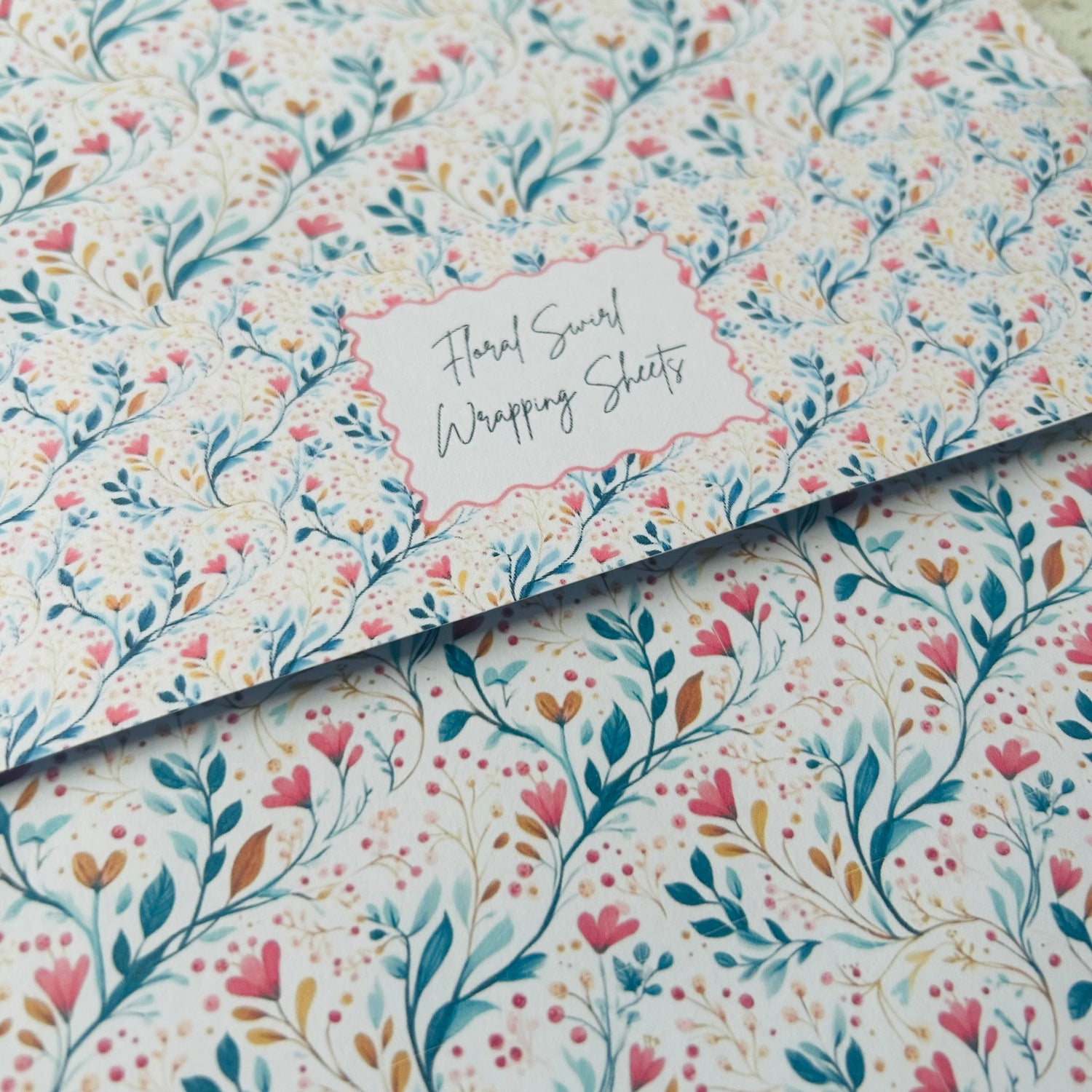 Floral patterned wrapping sheets with 'Floral Scroll Wrapping Sheets' text.