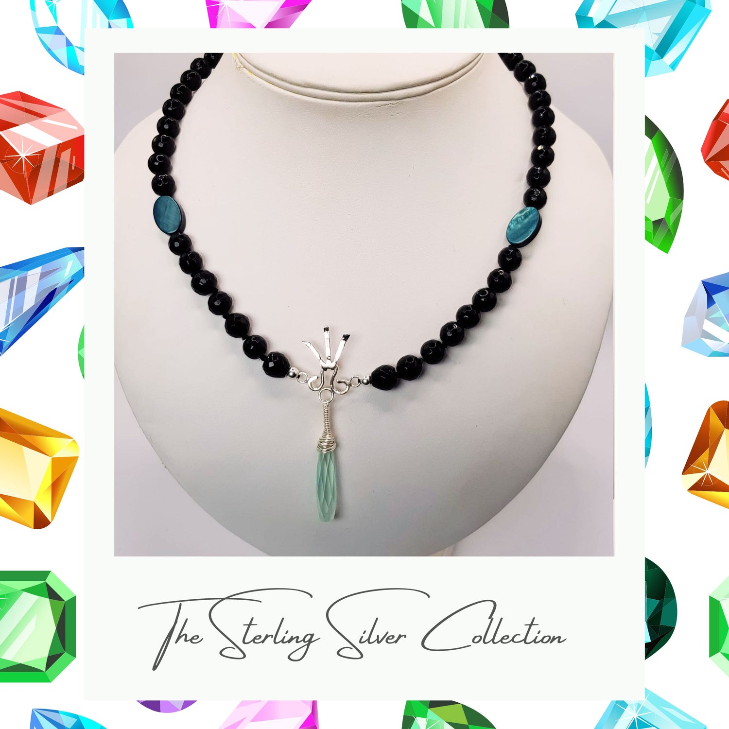 A gemstone necklace on a stand with black agate