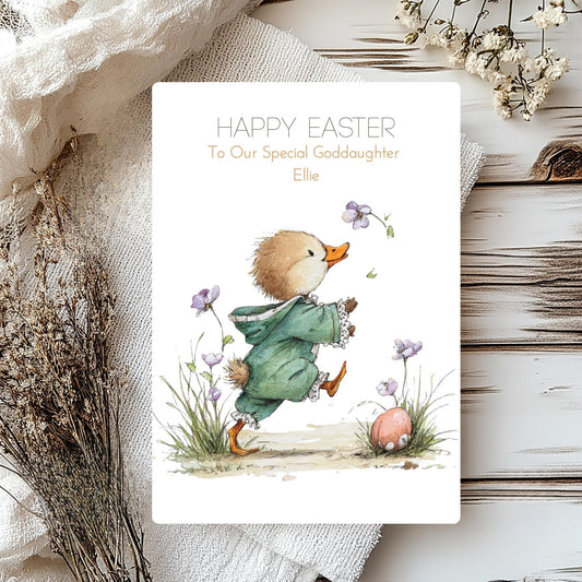 Easter card with a duckling and flowers on a wooden surface
