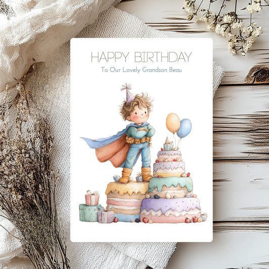 Birthday card with a child in a superhero costume standing on a birthday cake, surrounded by flowers and ribbons.