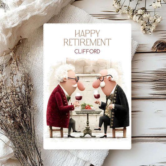 Retirement card with two cartoon men sitting at a table, holding wine glasses, on a decorative background.