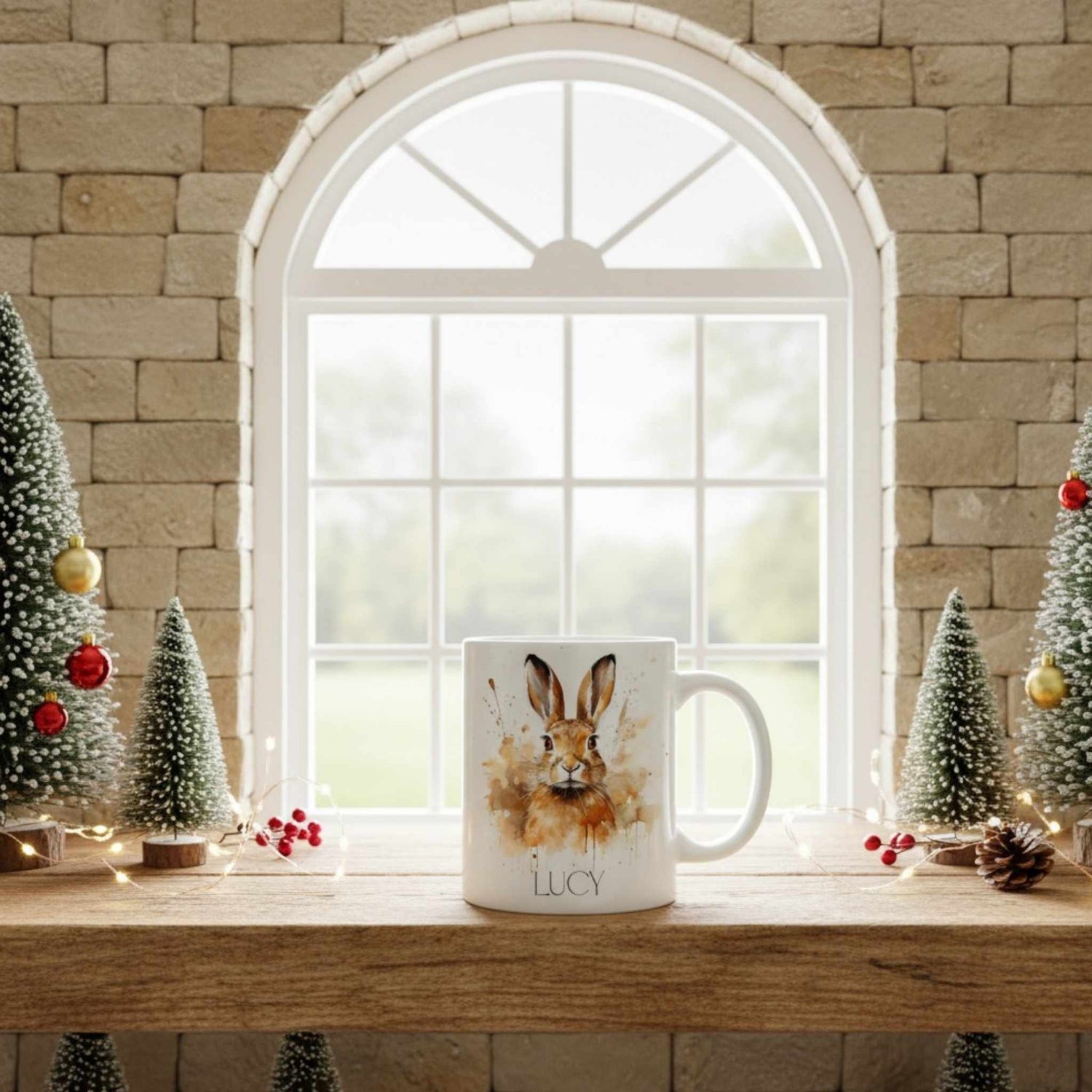 Mug with a hare design on a windowsill with Christmas decorations