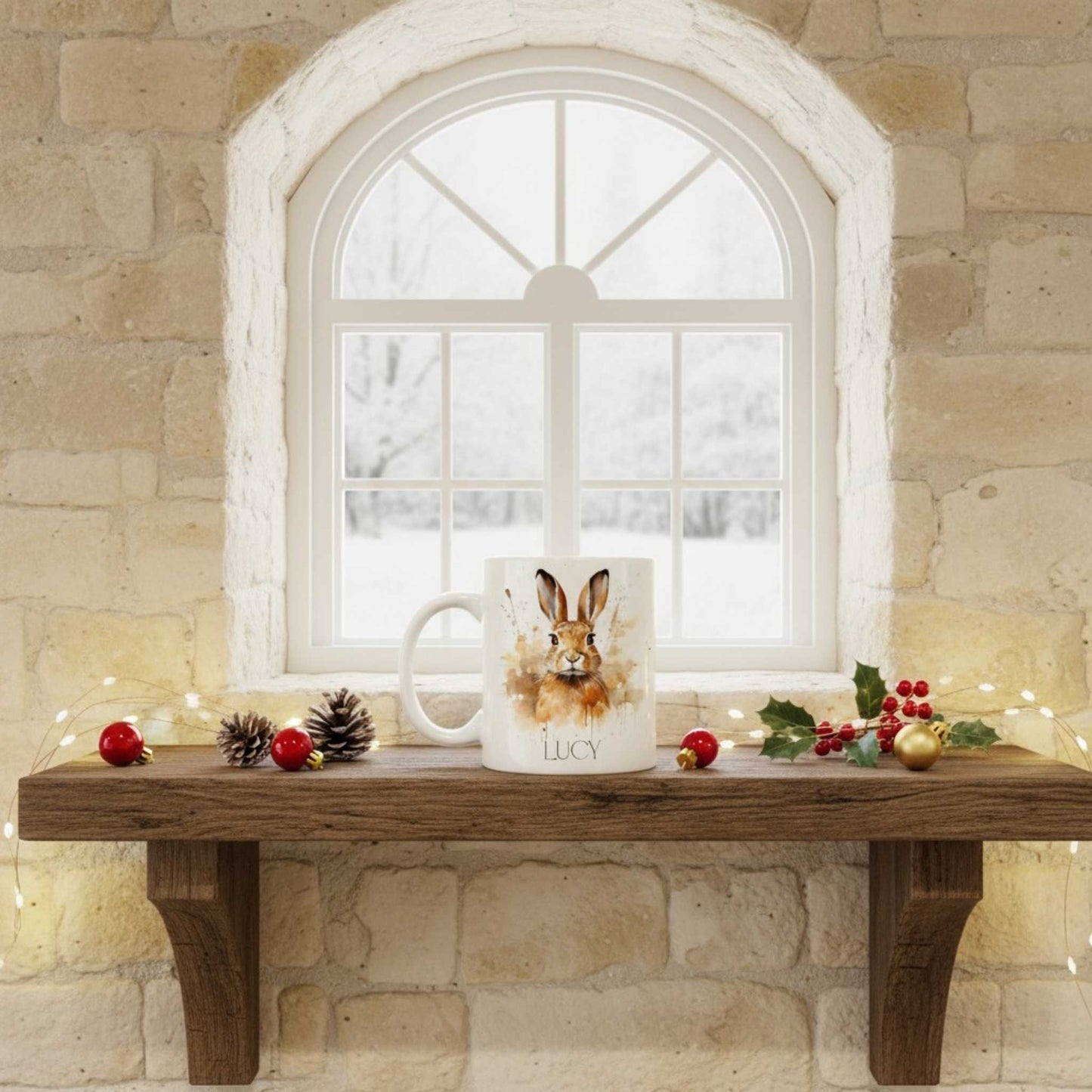 Mug with a hare design on a wooden bench in front of a window with Christmas decorations.