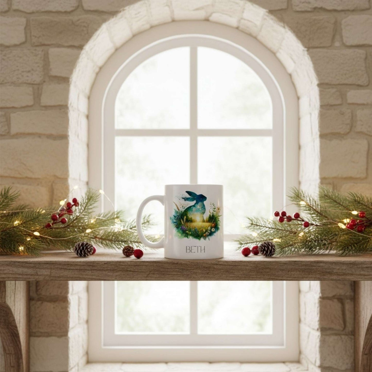 Mug with a hare design on a windowsill decorated with greenery and berries.