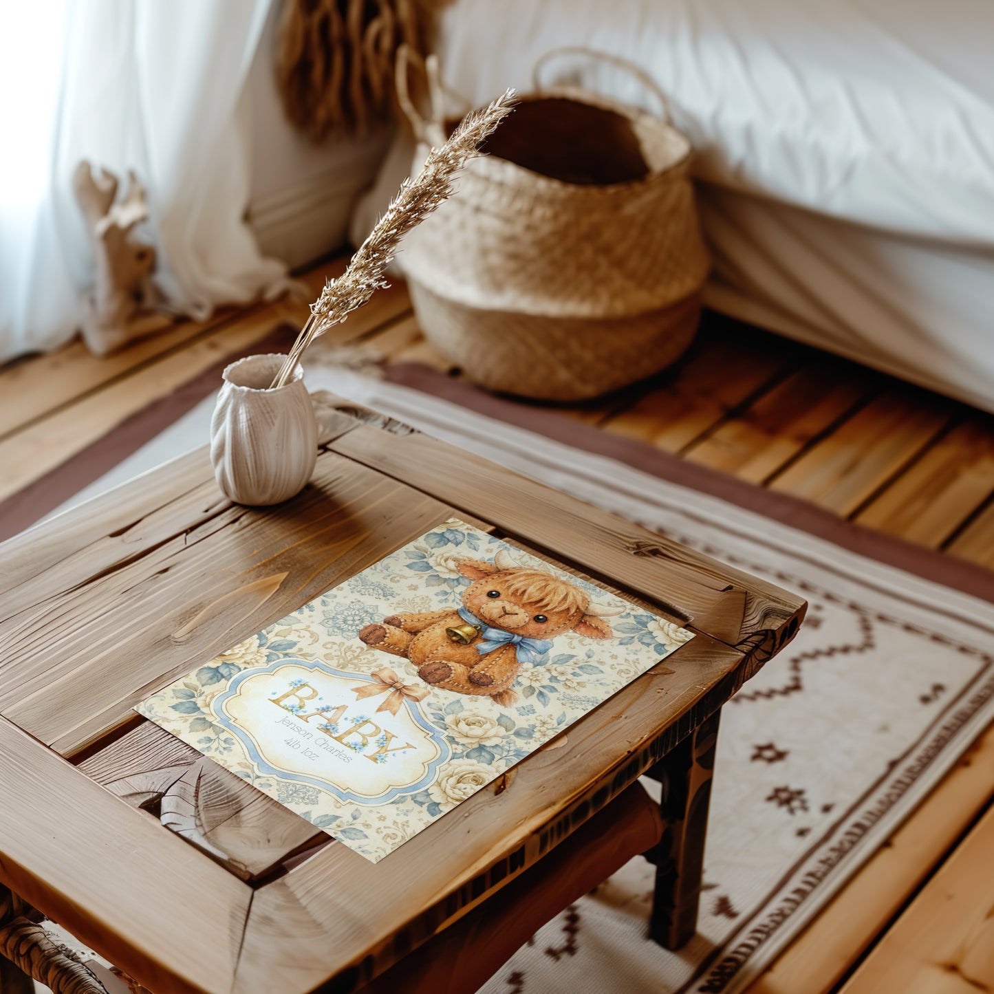 Wooden table with a decorative placemat featuring a highland cow illustration and the word 'Baby' in a cosy room.