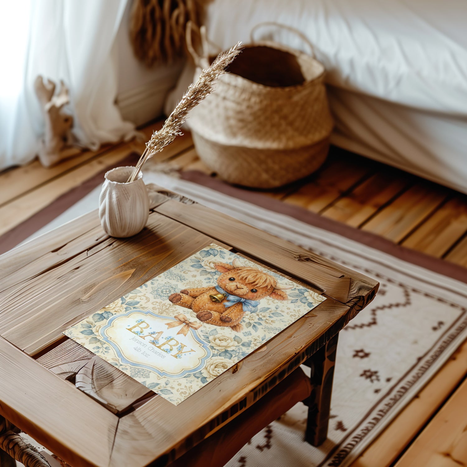 Wooden table with a decorative placemat featuring a highland cow illustration and the word 'Baby' in a cosy room.