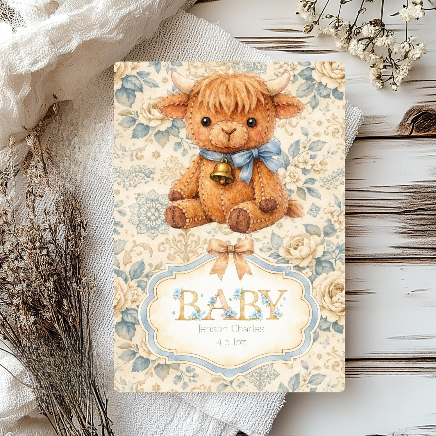 Baby card with a highland cow illustration on a floral background