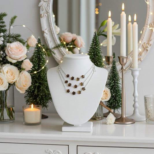 Labradorite Necklace on jewellery display with necklaces on a white bust, surrounded by candles and festive elements.